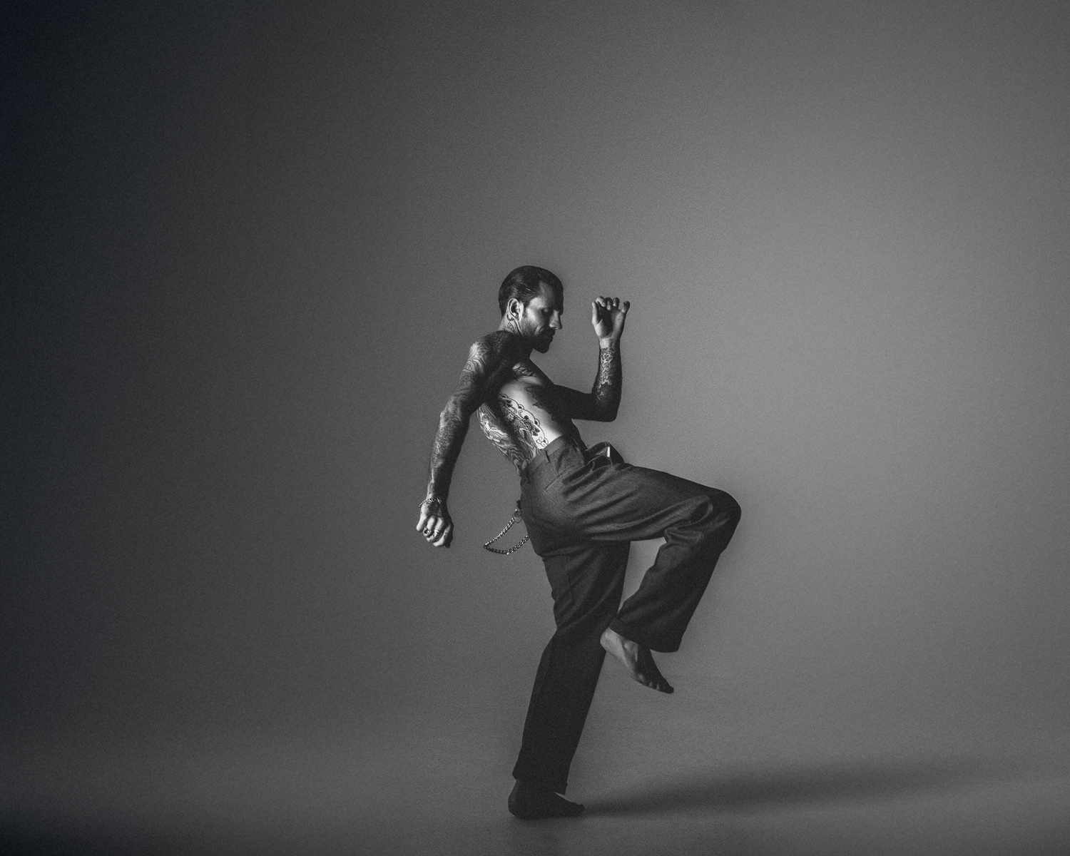 Dancer in a dynamic pose on a plain background