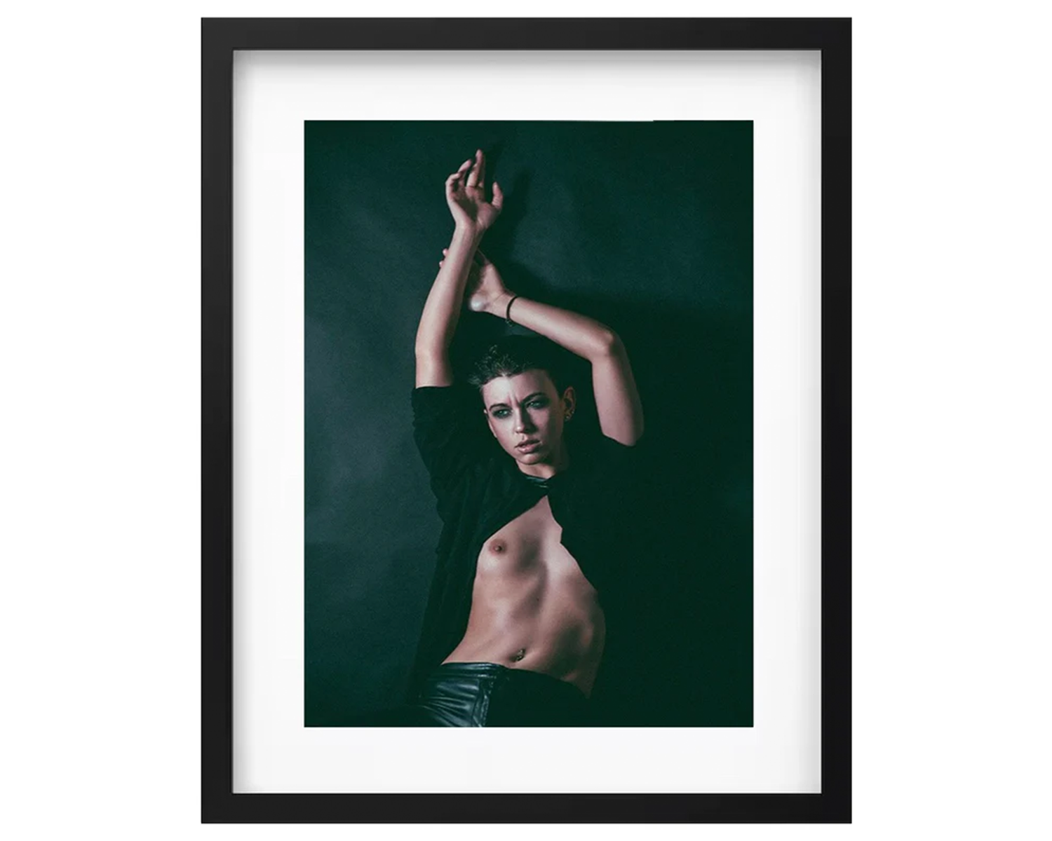 Framed portrait of a girl with arms raised against a dark background