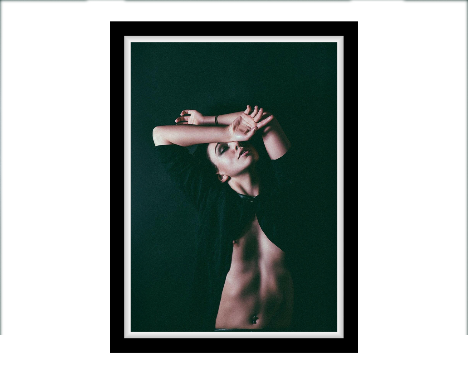 Framed portrait of a girl with arms crossed against a dark background