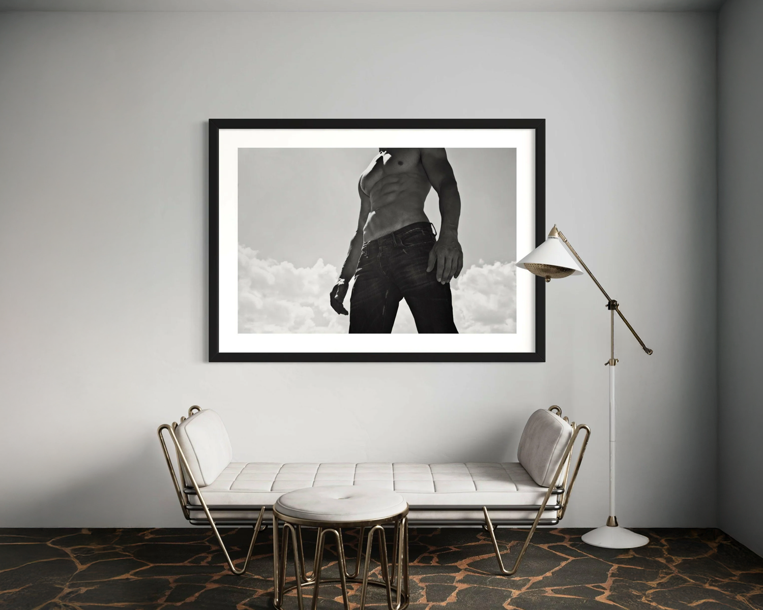 Framed black and white artwork of Black-and-white image of a muscular man standing with his torso bare, wearing jeans and striking a strong pose against a cloudy sky.