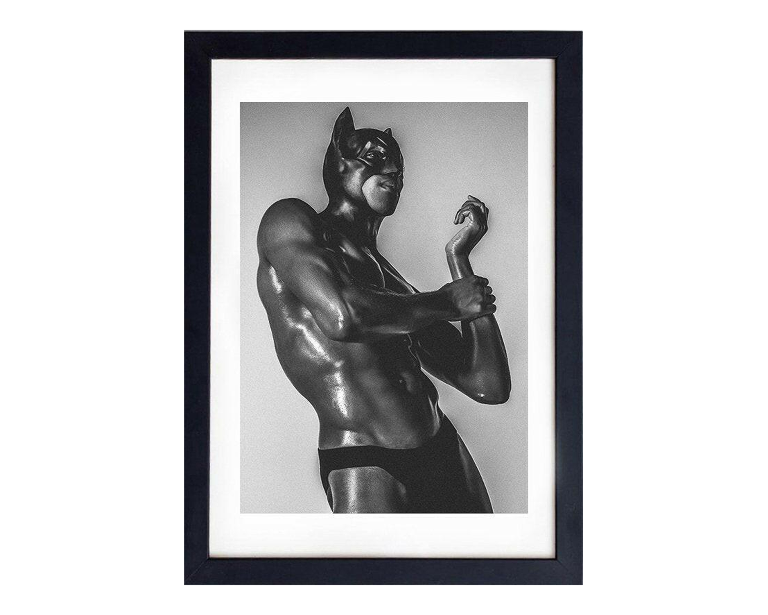 Framed black and white photo of A muscular figure in a black superhero costume striking a pose against a neutral background, exuding a strong and confident vibe.