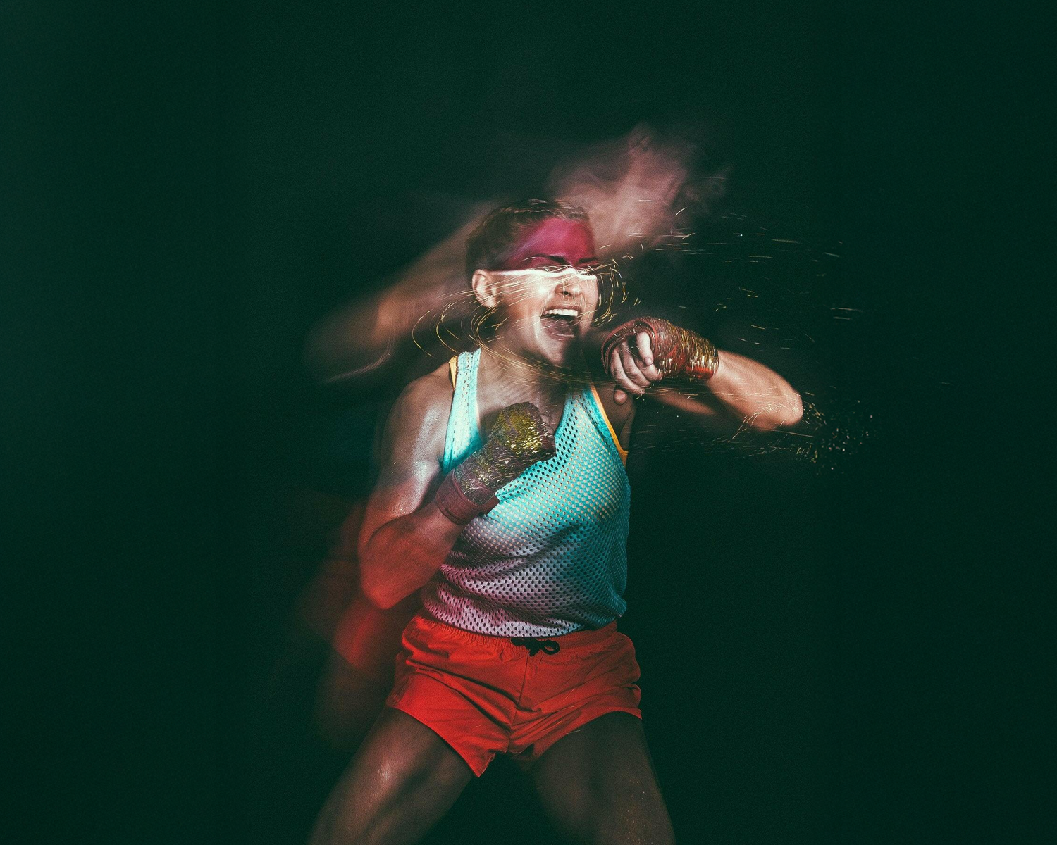 girl in athletic wear with a dark background